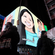 An animated picture of Michelle Go is displayed in Times Square during an evening vigil for the 40- year-old New Yorker after she who was killed in January 2022. Go, an Asian American, was pushed by a stranger in front of a train at the Times Square subway station.